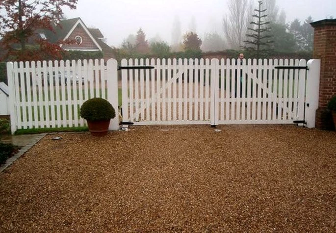 Gate technician repairing an off-track sliding gate